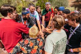 staff all placing hands in middle