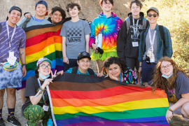 Camp Brave Trails campers with flag