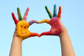 painted hands making heart shape