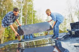 adult and child unloading truck