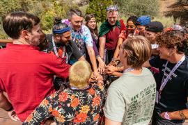 camp staff in huddle