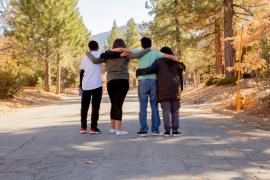 group of teenagers with arms around each other