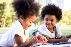 young kids painting in park