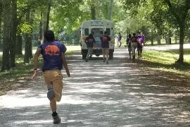 staff running to great camper bus