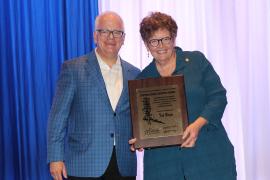 Tom Rosenberg presenting Tish Bolger her award