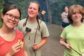 campers holding s'mores