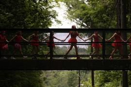 Campers walking over bridge