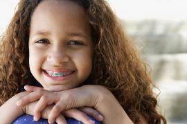 Child smiling with braces