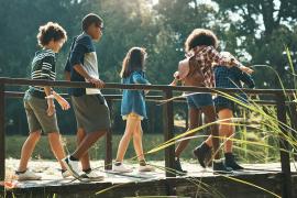 Kids walking over bridge