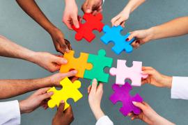 People holding puzzle pieces