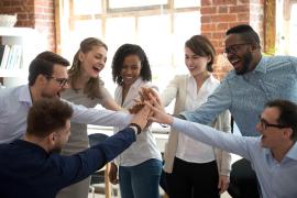 team of coworkers high fiving