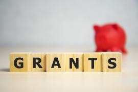 Letter tiles spelling grants
