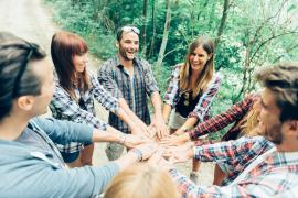 Young adults hands in circle