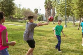 Kids playing with ball outdoors