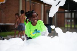 Camper playing in foam