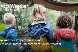 Kids in rain coats looking off into the distance in the woods; Accuweather logo overlayed