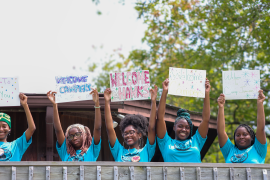 staff welcoming campers