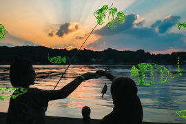 Two campers fishing at sunset
