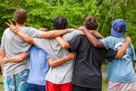 group standing together facing away from camera