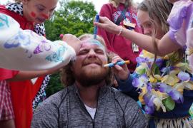 campers drawing on staff member's face