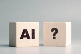 Wood blocks with "AI" and "?"
