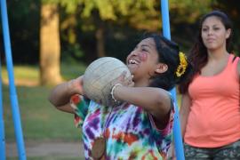 camper throwing a volleyball