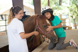 camper and staff with horse