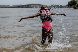 camper wearing life jacket in lake