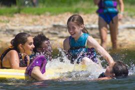campers playing in water