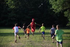 campers running away across field