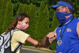 Camper and director with masks