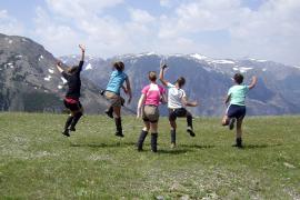 campers with mountains in background