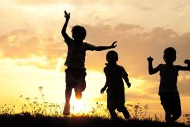 silhouettes of kids at sunset