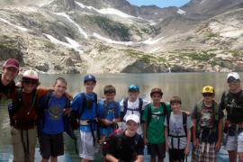 group of kids next to lake