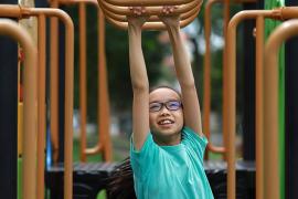 child on monkey bars