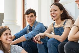 stock photo of friends sitting and laughing