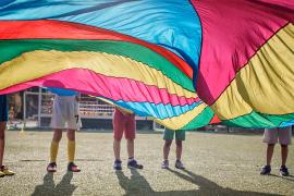kids playing with parachute